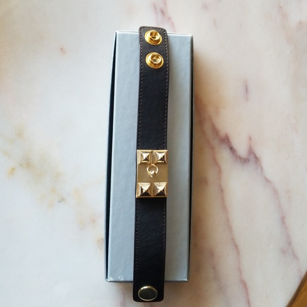 Black cuff bracelet with gold hardware